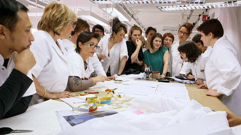 Dior's expert seamstresses at work. Photo Credit: CIM Productions
